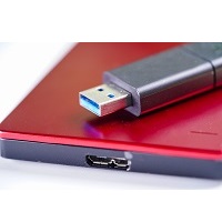External Hard Disk Color Red With Usb Thumb Drive Isolated On Wh